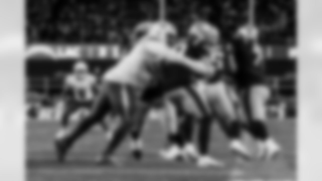 Check out the best shots from the Chargers Wild Card matchup against the Patriots!