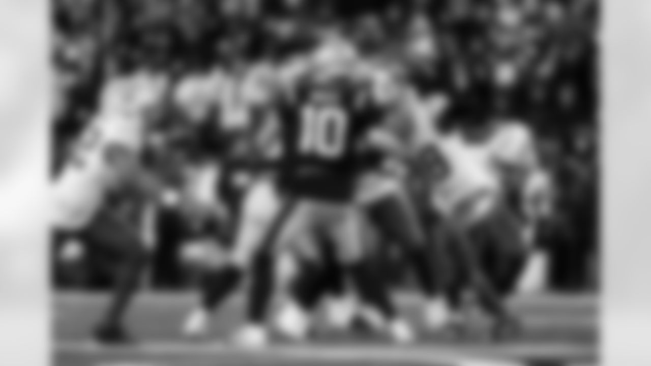 OLB Khalil Mack (52) and OLB Odafe Oweh (98)