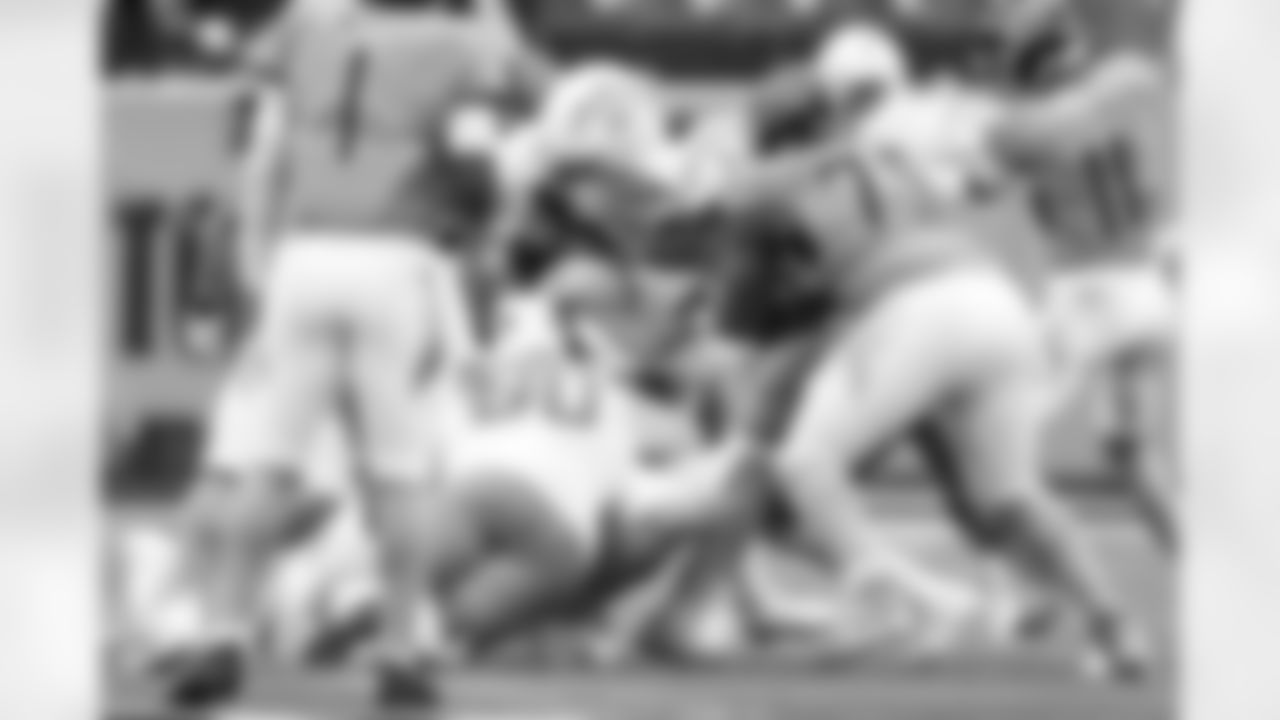 DT Jamaree Caldwell (99), LB Daiyan Henley (0) and DL Teair Tart (90)