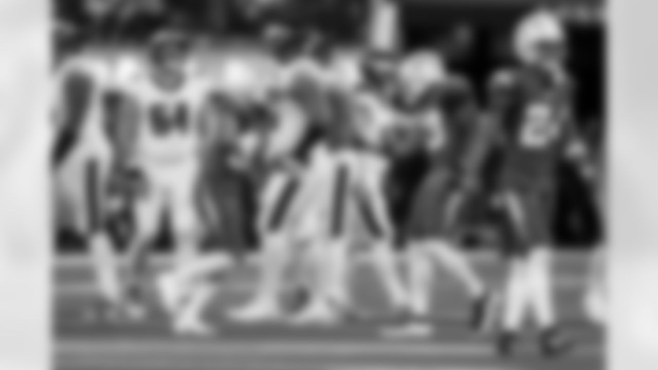 DB Deane Leonard (33) and LB Del'Shawn Phillips (53)