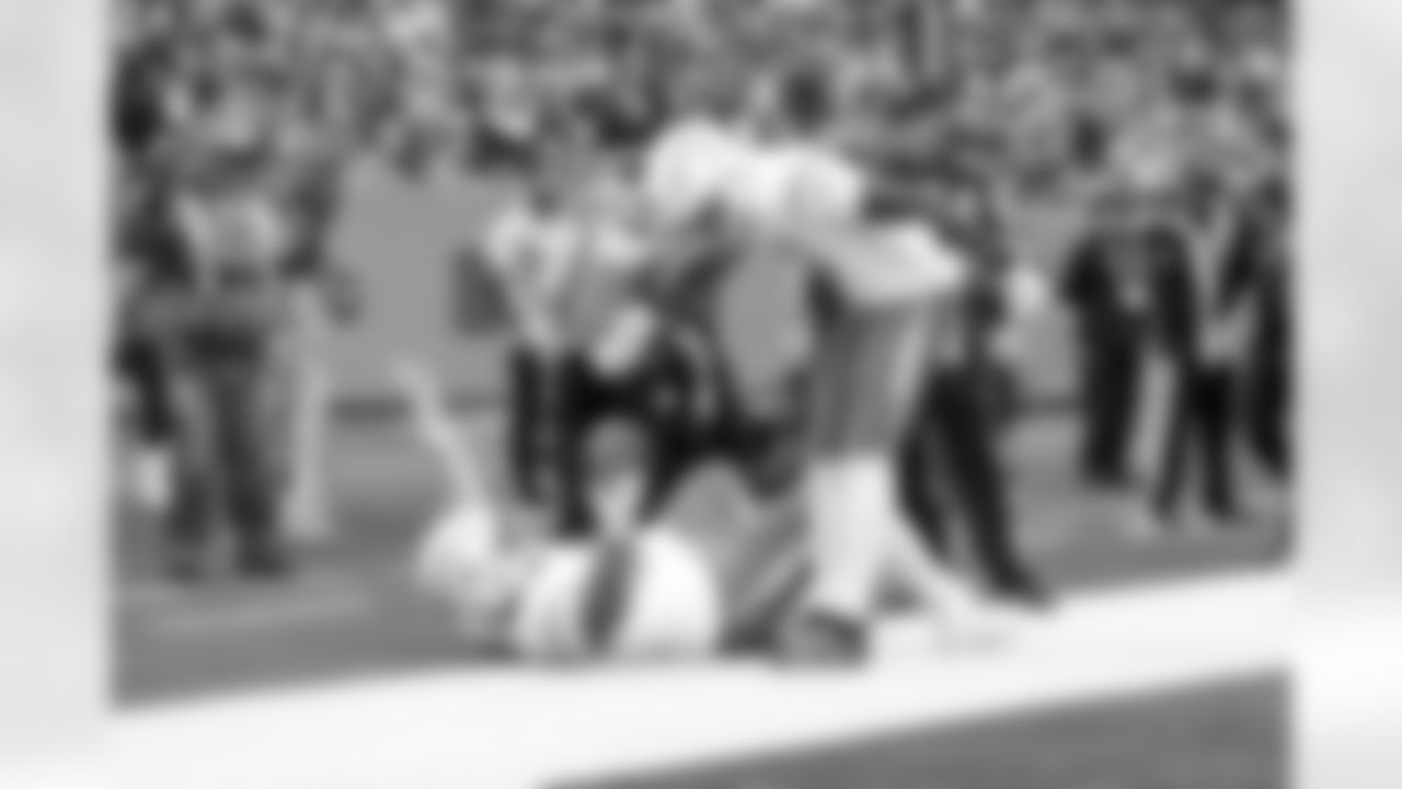 DL Scott Matlock (44) and WR Tre Harris (9)