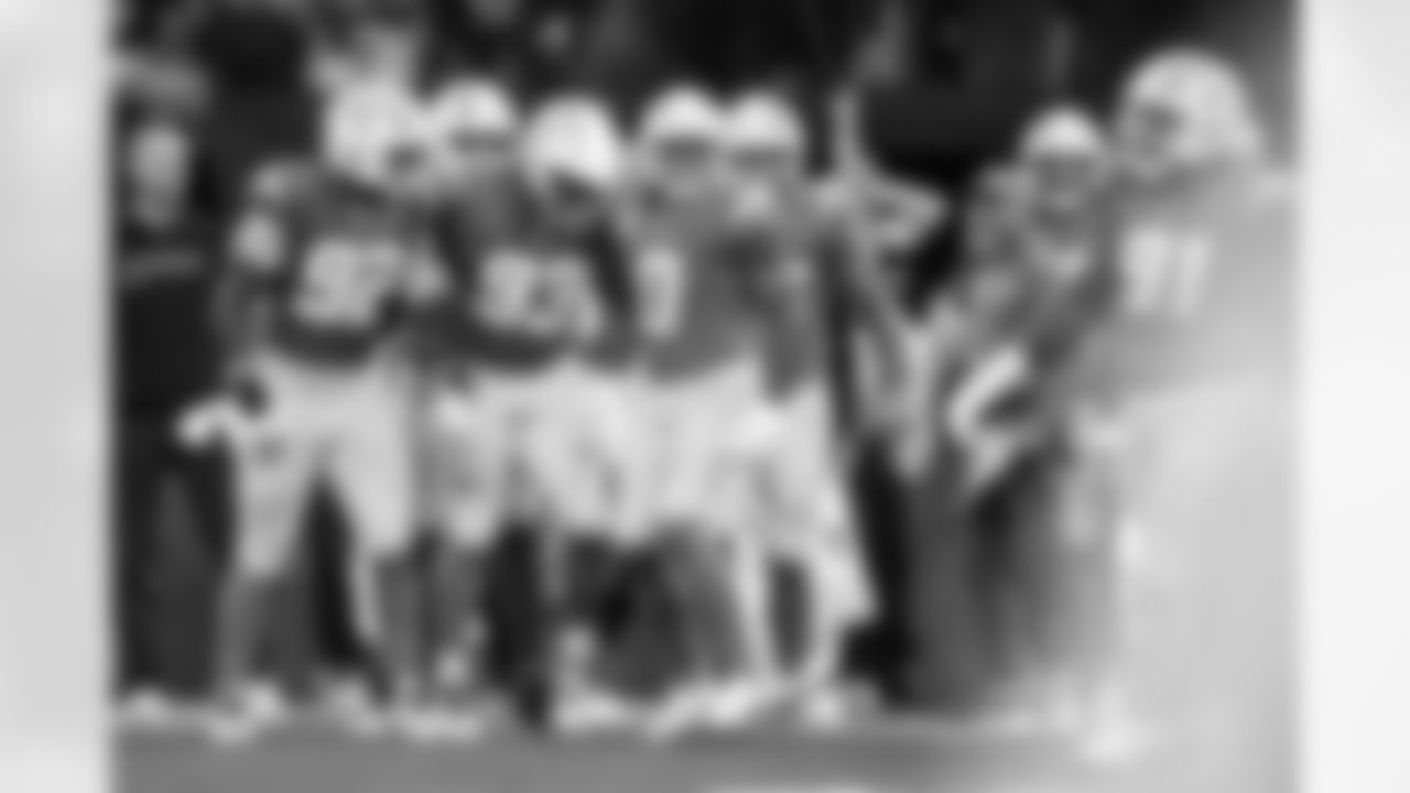 DL Justin Eboigbe (92), DL Otito Ogbonnia (93), LB Daiyan Henley (0) and DL Da'Shawn Hand (91)