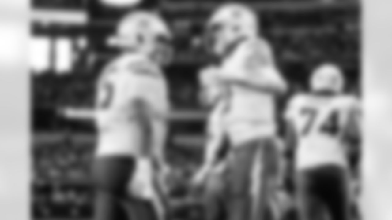 C Bradley Bozeman (75) and QB Justin Herbert (10)