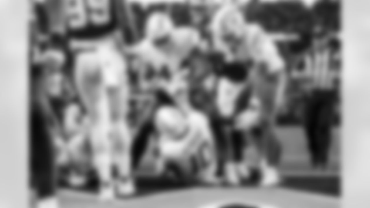 DL Scott Matlock (44) and QB Justin Herbert (10)