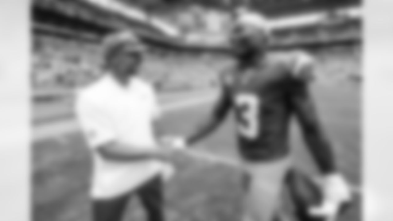 Defensive Coordinator Jesse Minter and S Derwin James Jr. (3)