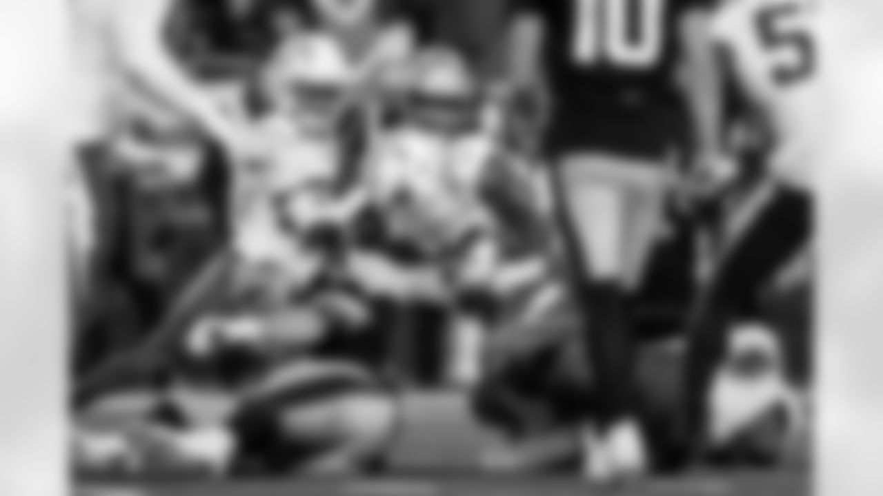 Check out the best shots from the Chargers Wild Card matchup against the Patriots!