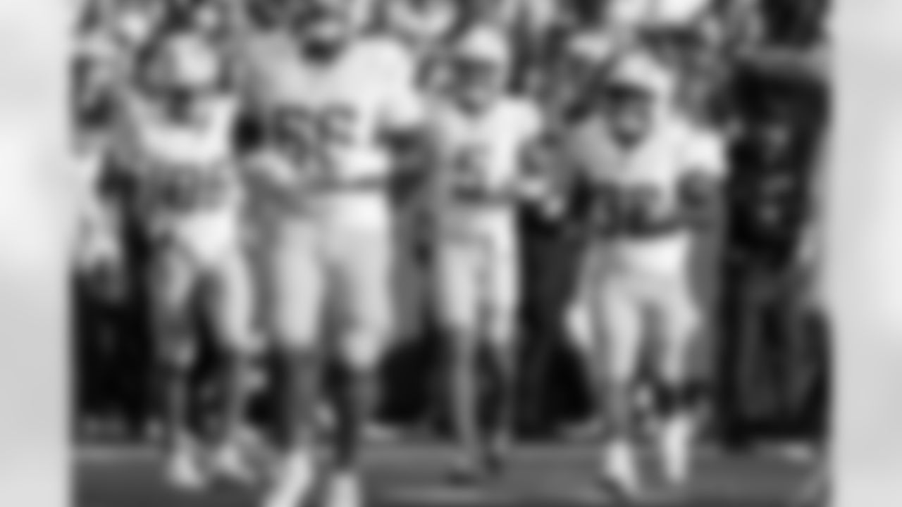 TE Oronde Gadsden (86), QB Trey Lance (5) and RB Jaret Patterson (32)