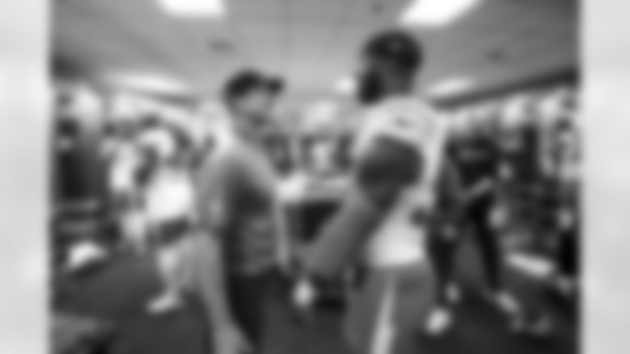 Head Coach Jim Harbaugh and OLB Odafe Oweh (98)