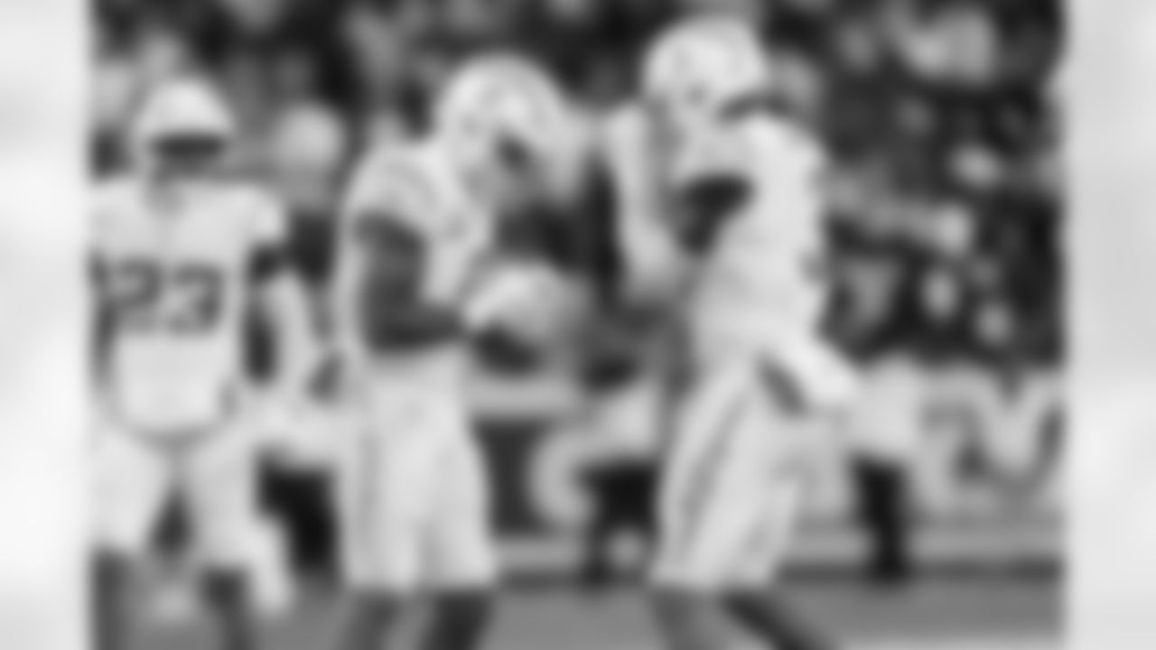 LB Daiyan Henley (0) and S Derwin James Jr. (3)