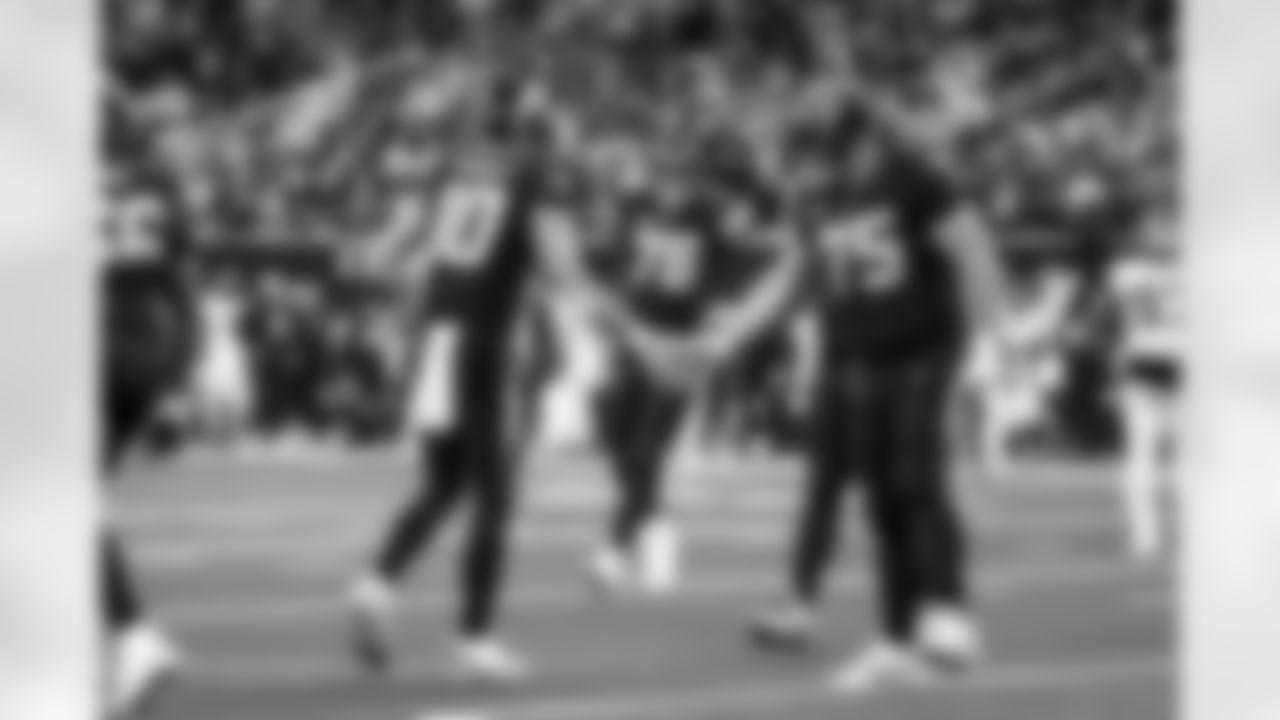 QB Justin Herbert (10) and C Bradley Bozeman (75)
