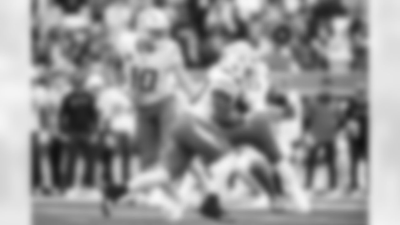 QB Justin Herbert (10) and RB Kimani Vidal (30)