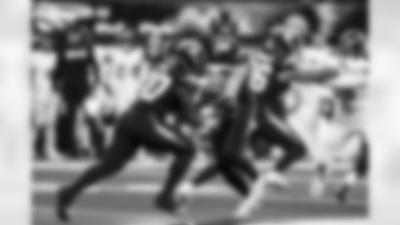 RB Kimani Vidal (30) and QB Justin Herbert (10)