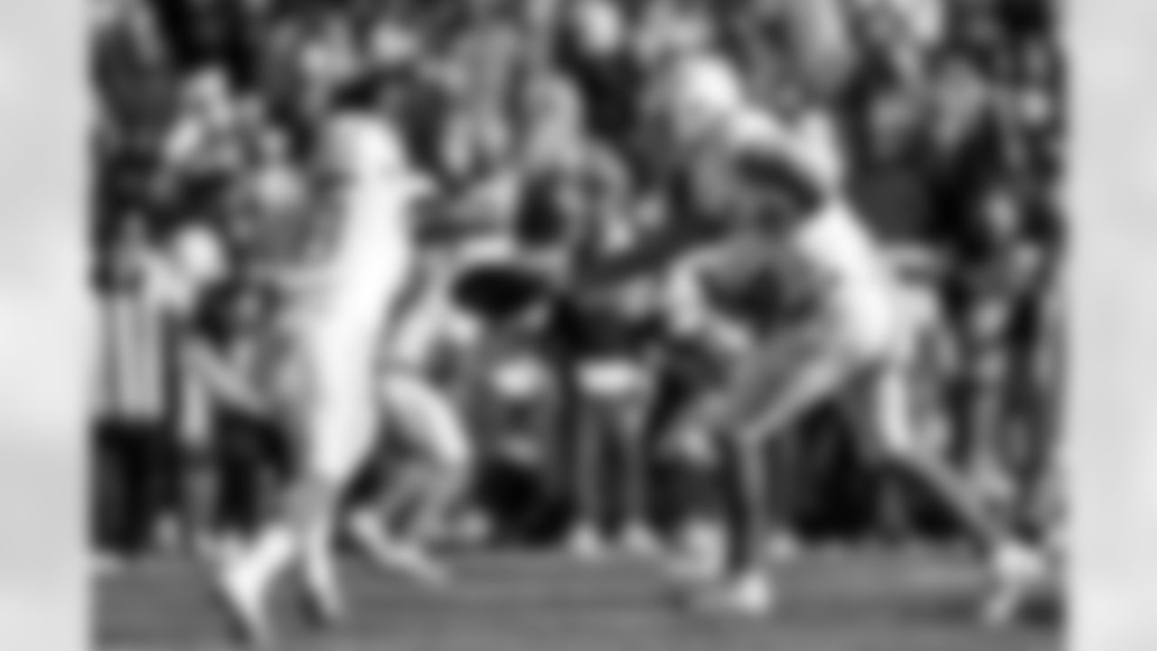 RB Omarion Hampton (8) and QB Justin Herbert (10)