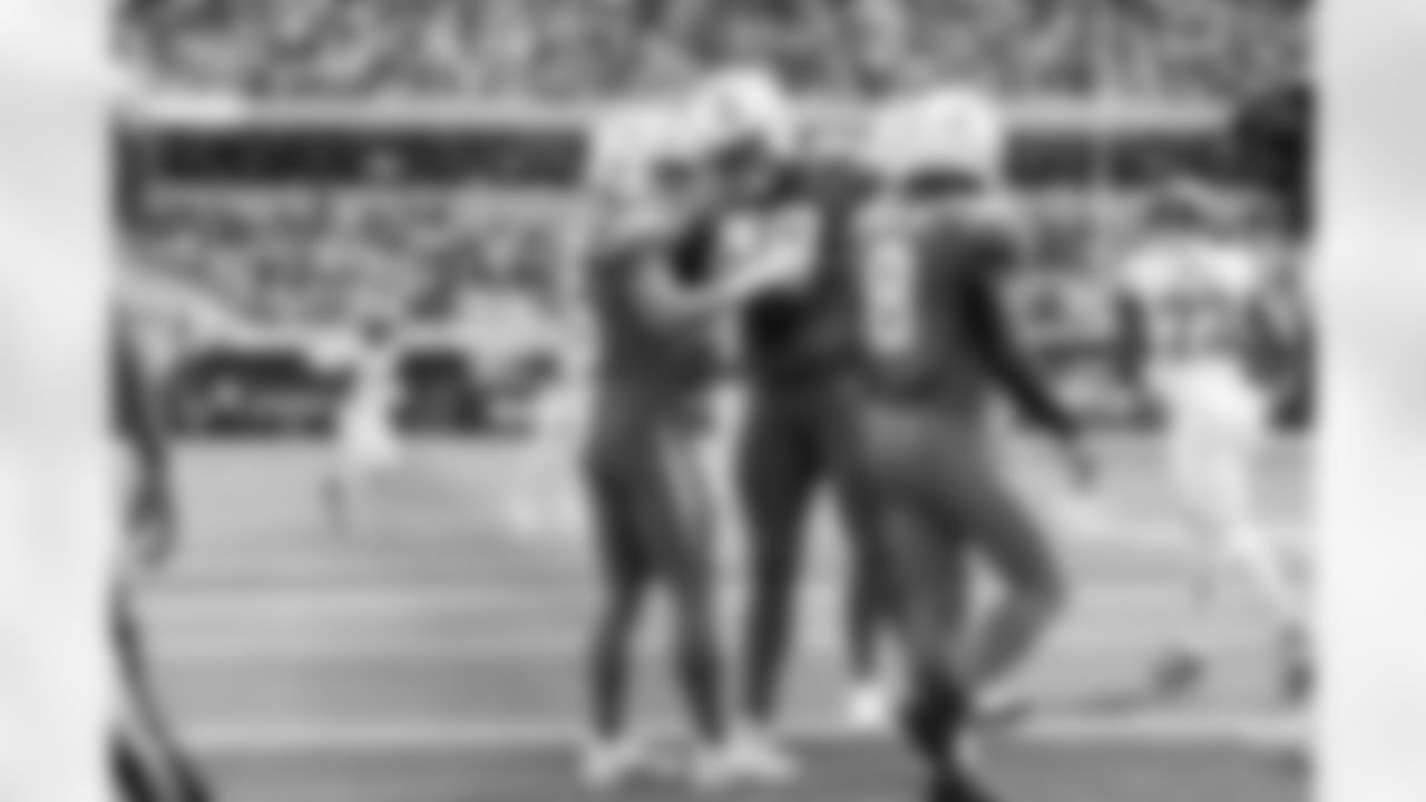 WR Ladd McConkey (15) and T Trey Pipkins III (79)