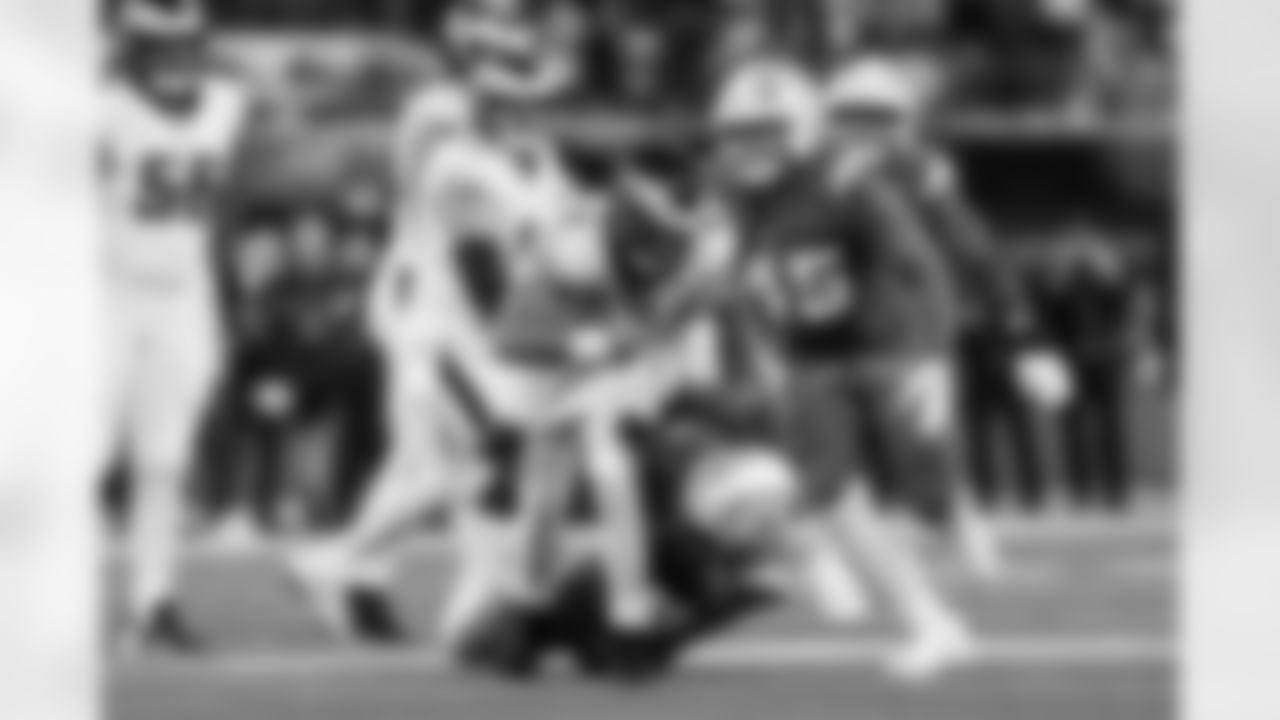 OLB Tuli Tuipulotu (45) and OLB Odafe Oweh (98)