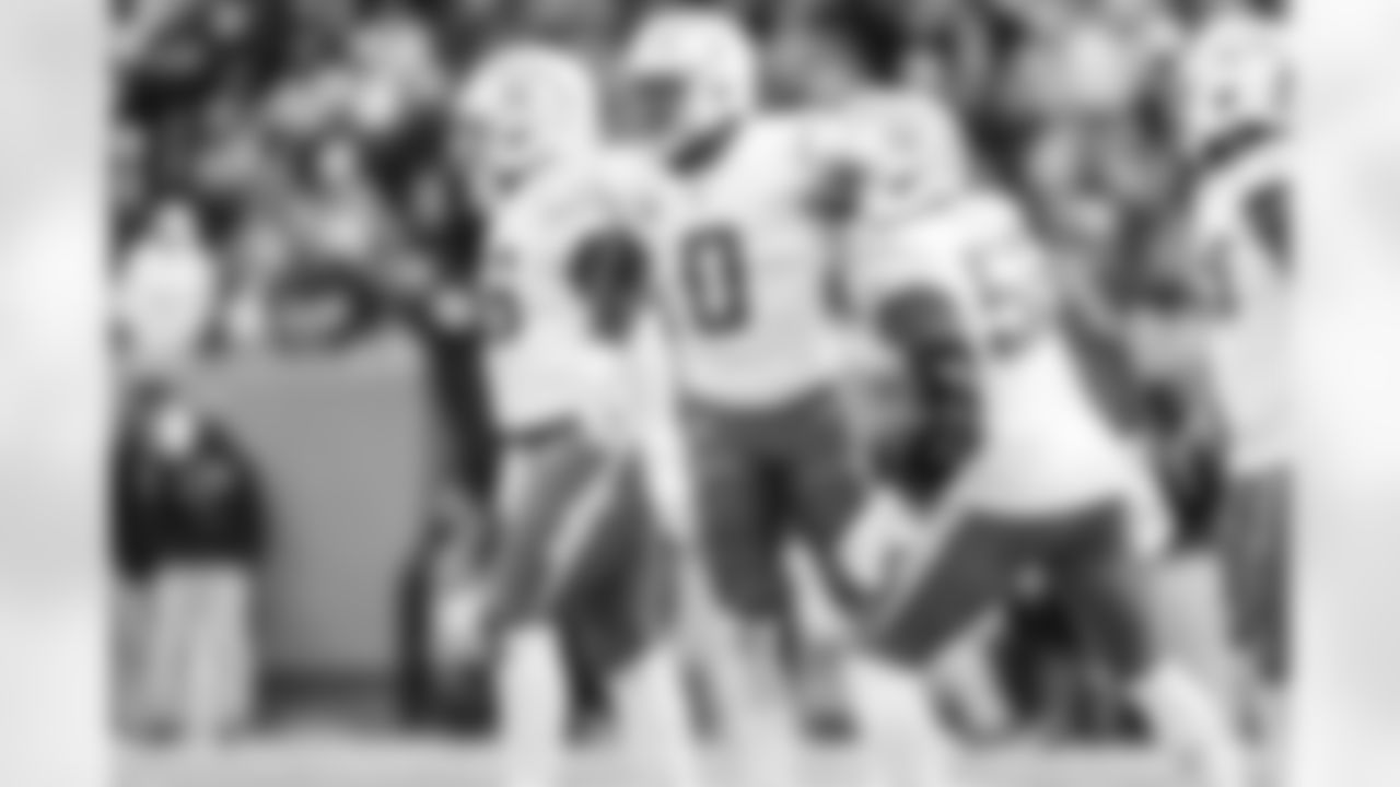 LB Daiyan Henley (0) and OLB Khalil Mack (52)