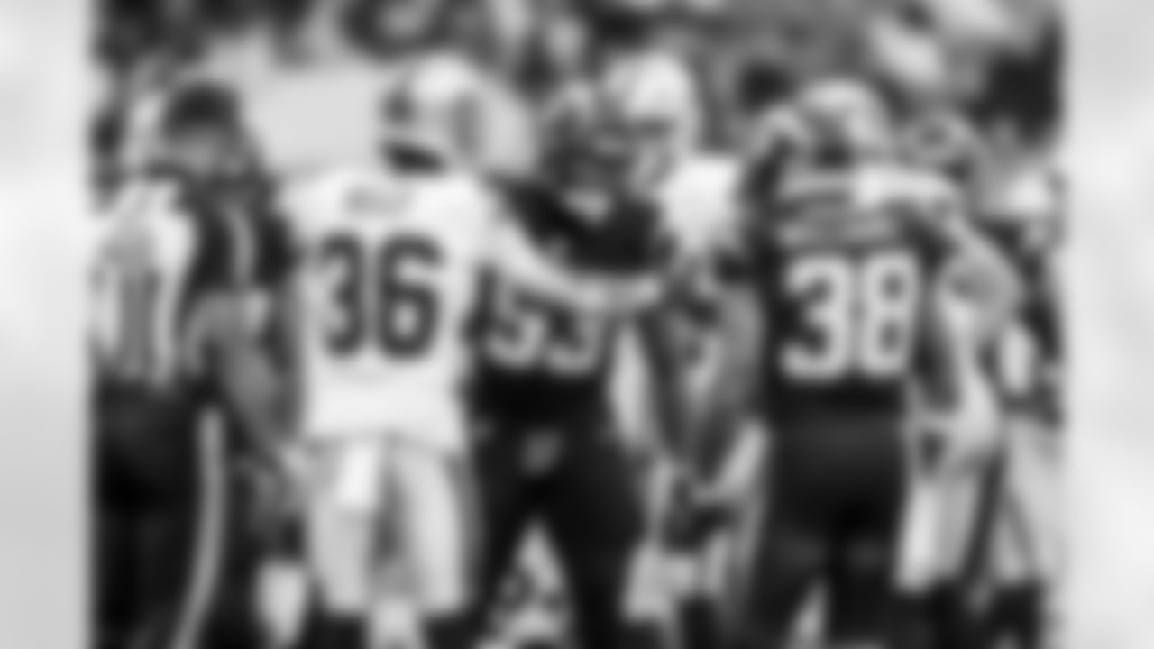 LB Del'Shawn Phillips (53) and RB Trayveon Williams (38)