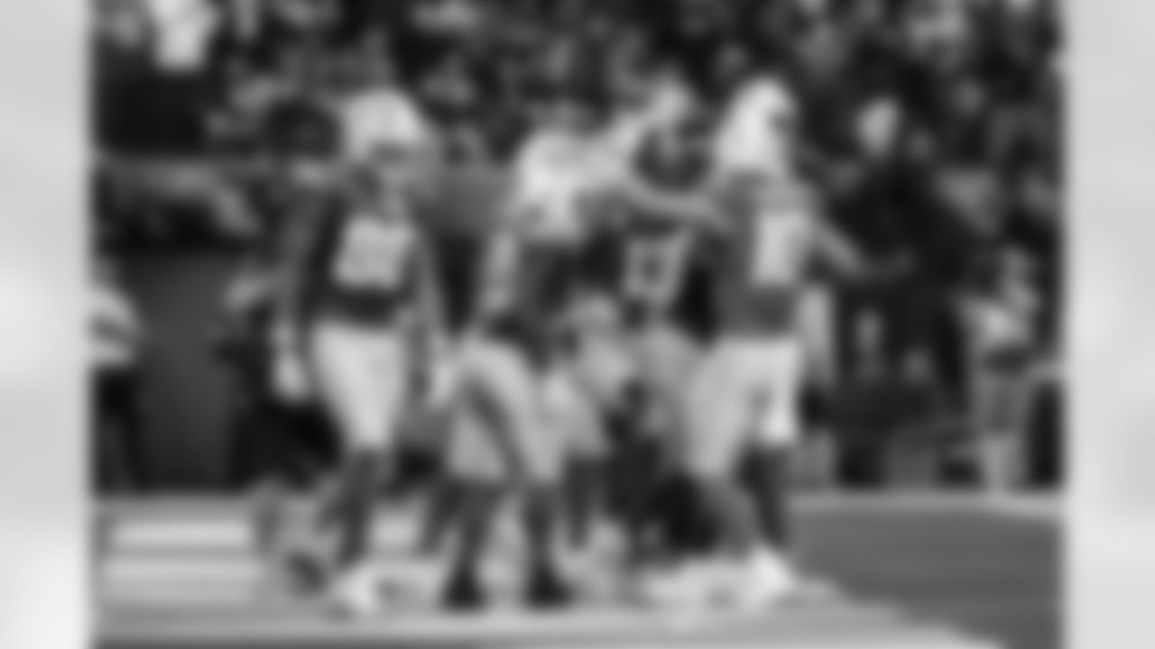 RB Kimani Vidal (30) and QB Justin Herbert (10)