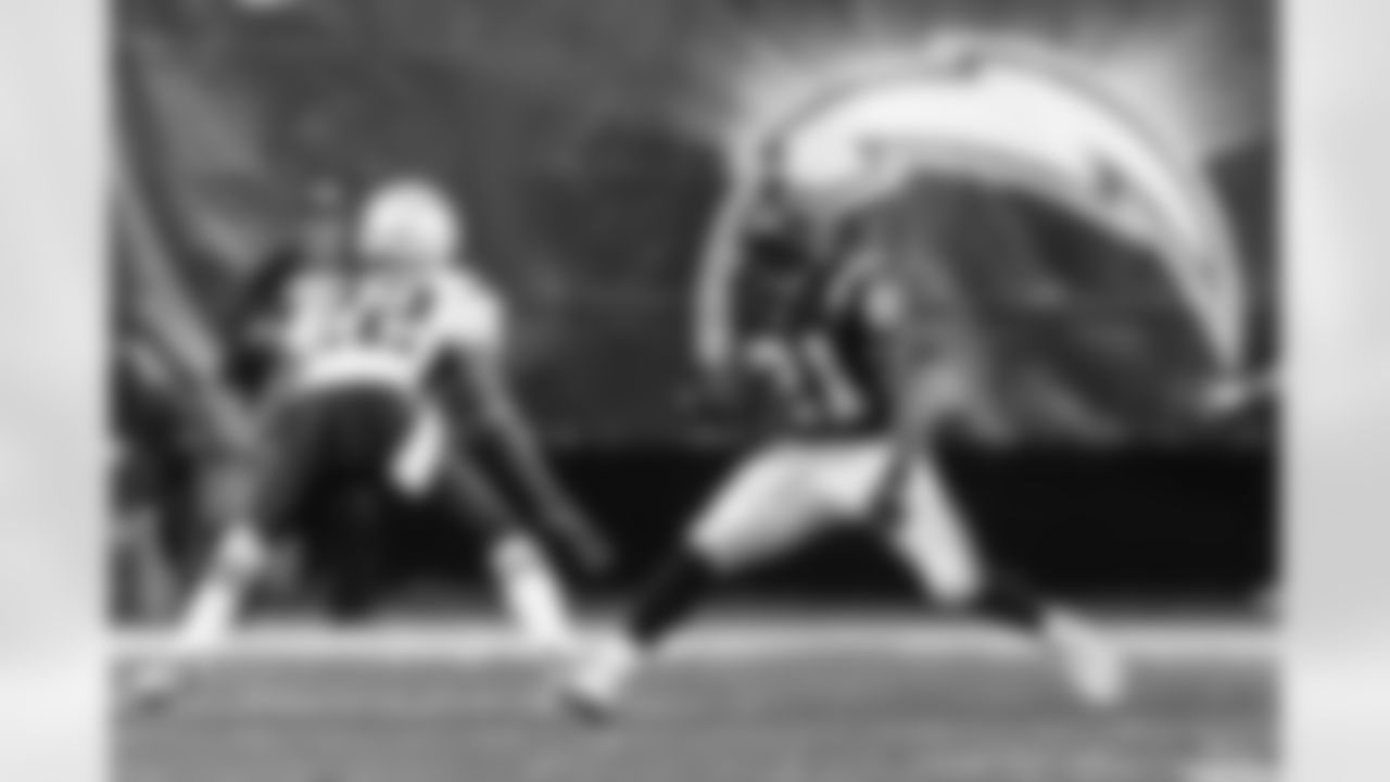 Relive the Chargers' postseason appearances through images from playoff games, highlighting the moments that defined the team in the NFL playoffs.