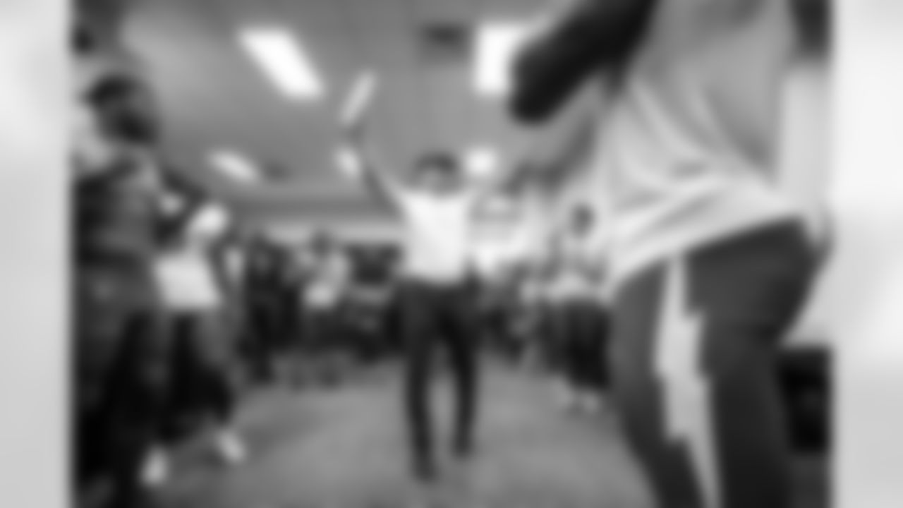 LB Daiyan Henley (0), S Tony Jefferson (23) and Head Coach Jim Harbaugh