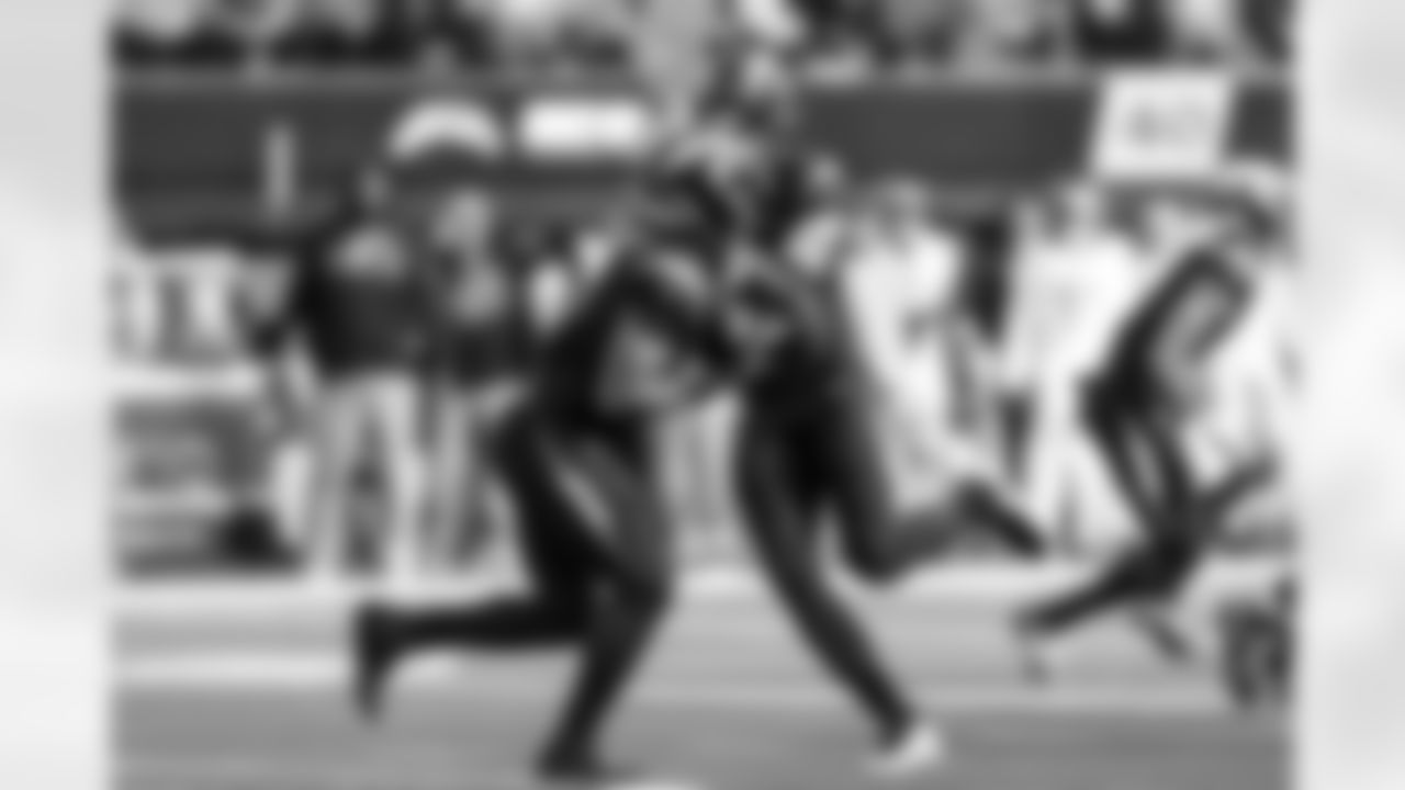 RB Omarion Hampton (8) and QB Justin Herbert (10)