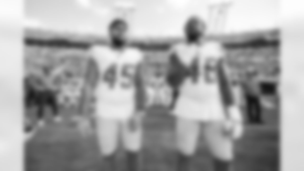 OLB Tuli Tuipulotu (45) and OLB Bud Dupree (48)