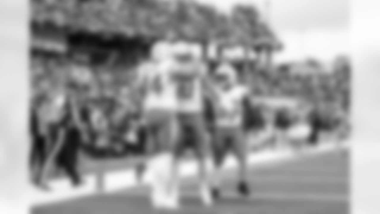 DL Scott Matlock (44) and QB Justin Herbert (10)