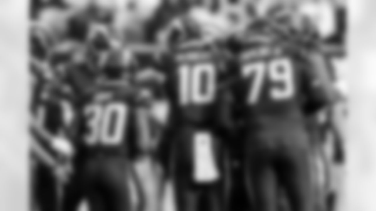 RB Kimani Vidal (30), QB Justin Herbert (10) and T Trey Pipkins III (79)