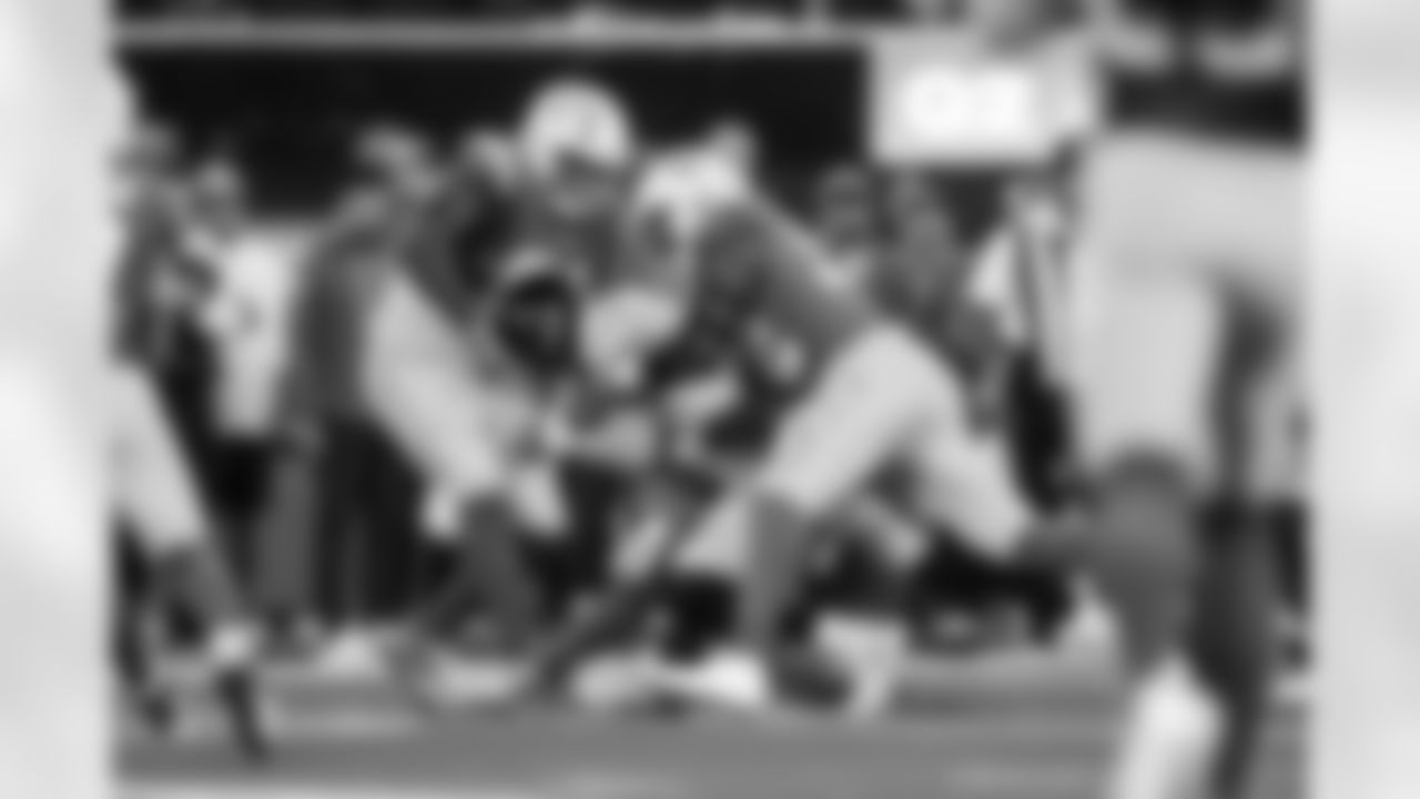 DL Teair Tart (90) and OLB Khalil Mack (52)