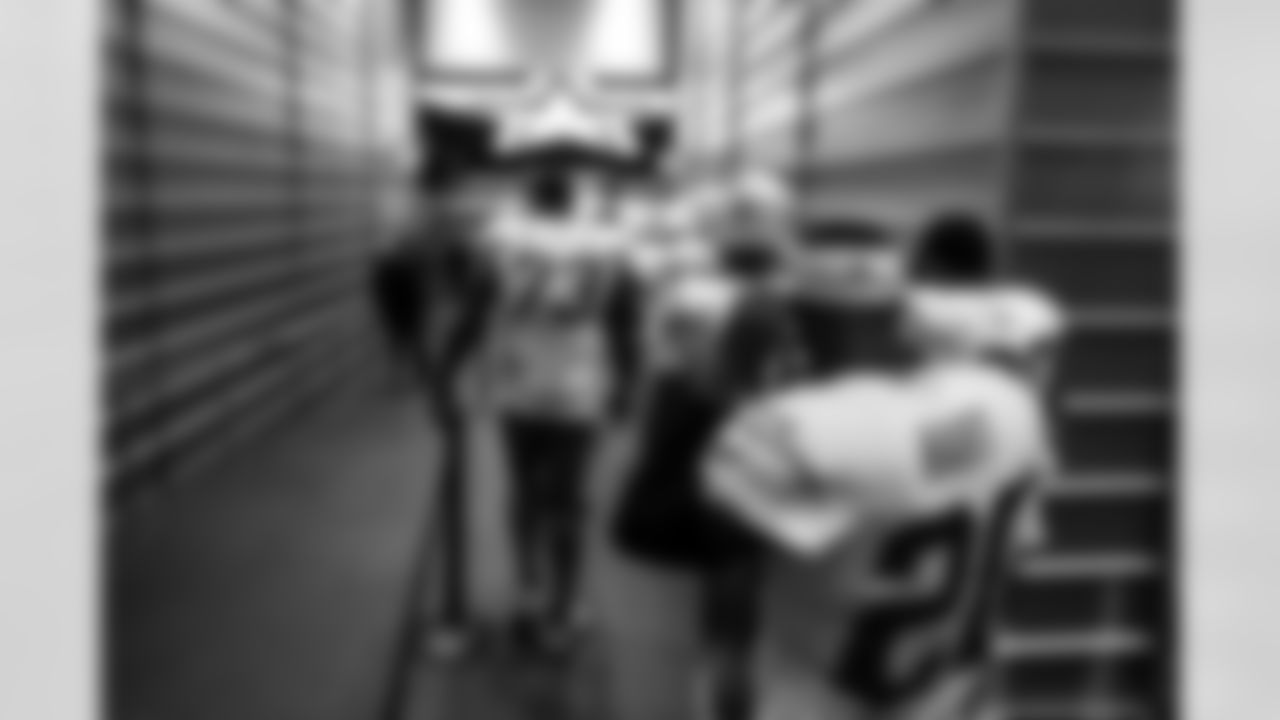 G Mekhi Becton (73) and CB Cam Hart (20)