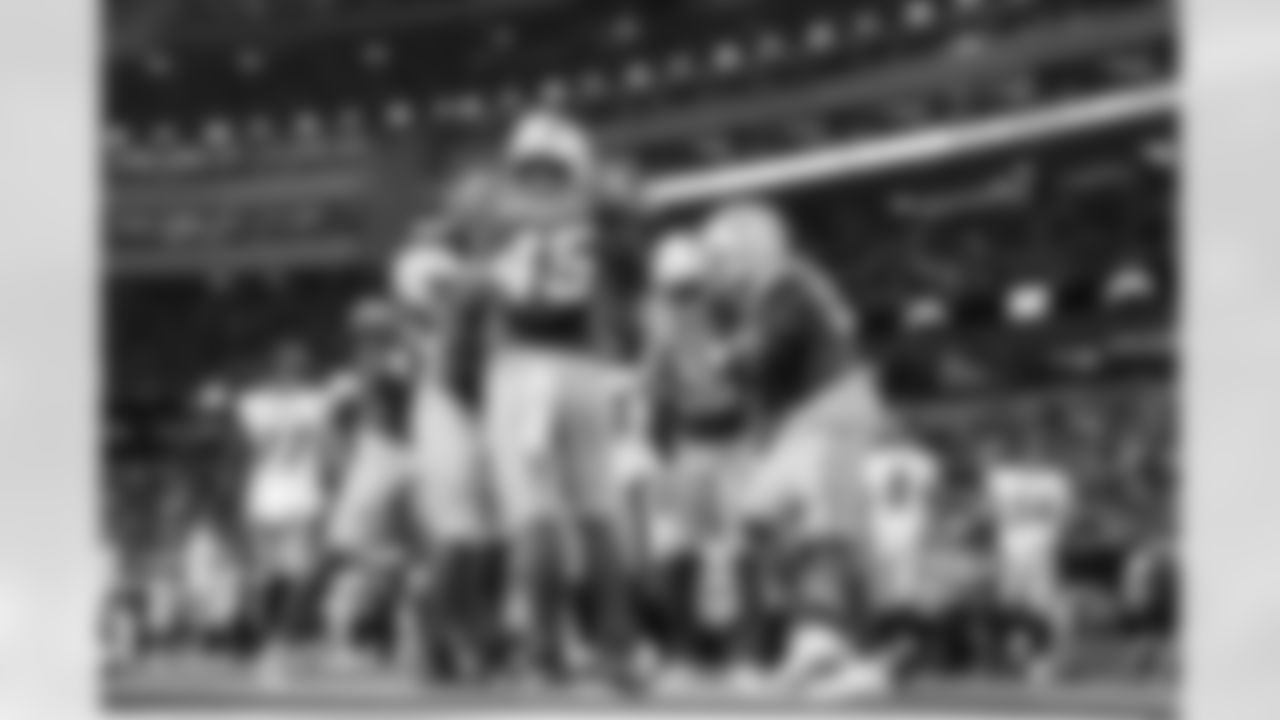 OLB Tuli Tuipulotu (45) and OLB Khalil Mack (52)