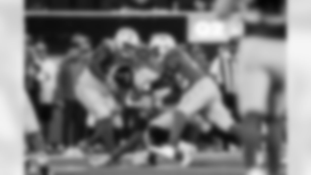 DL Teair Tart (90) and OLB Khalil Mack (52)