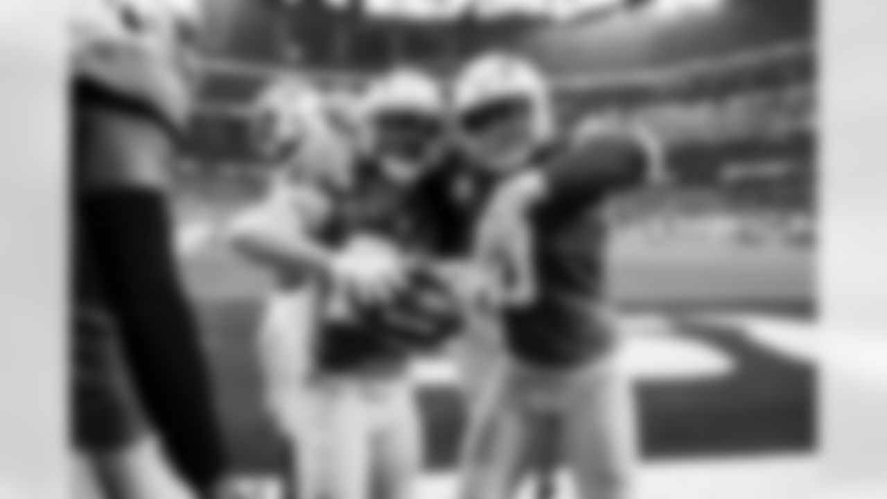 LB Daiyan Henley (0) and CB Donte Jackson (26)