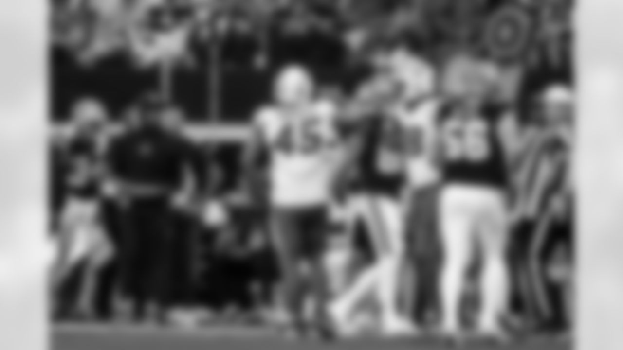 OLB Tuli Tuipulotu (45) and OLB Odafe Oweh (98)