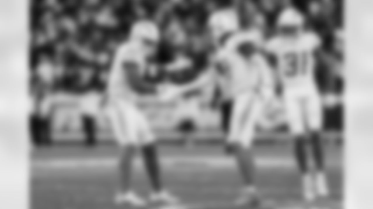 LB Daiyan Henley (0) and S Derwin James Jr. (3)