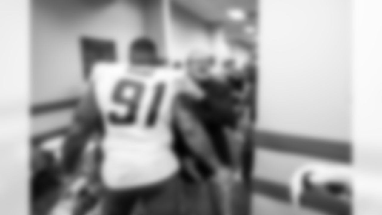 DL Da'Shawn Hand (91) and Dean Spanos