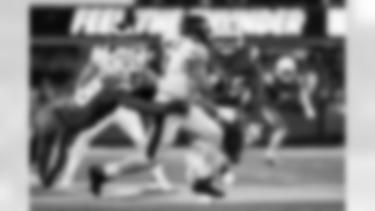 OLB Tuli Tuipulotu (45) and OLB Odafe Oweh (98)