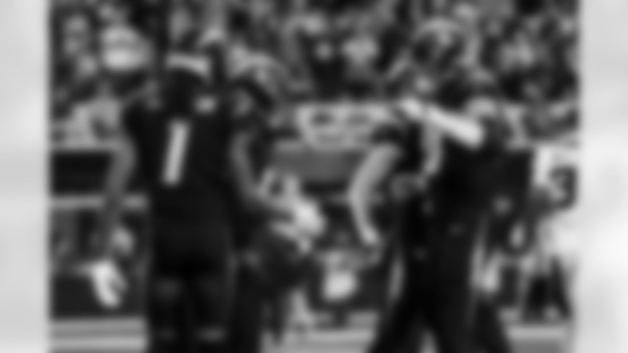 RB Omarion Hampton (8) and QB Justin Herbert (10)