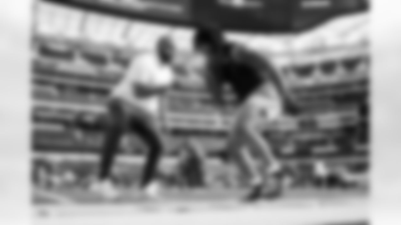 Running Backs Coach Kiel McDonald and RB Omarion Hampton (8)