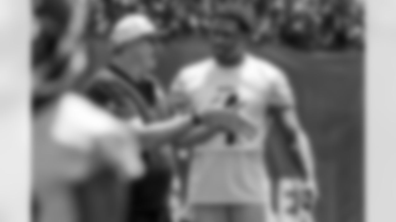 Pittsburgh Steelers wide receiver DK Metcalf, right, talks with offensive coordinator Arthur Smith during practice at NFL football minicamp in Pittsburgh, Wednesday, June 11, 2025. (AP Photo/Gene J. Puskar)