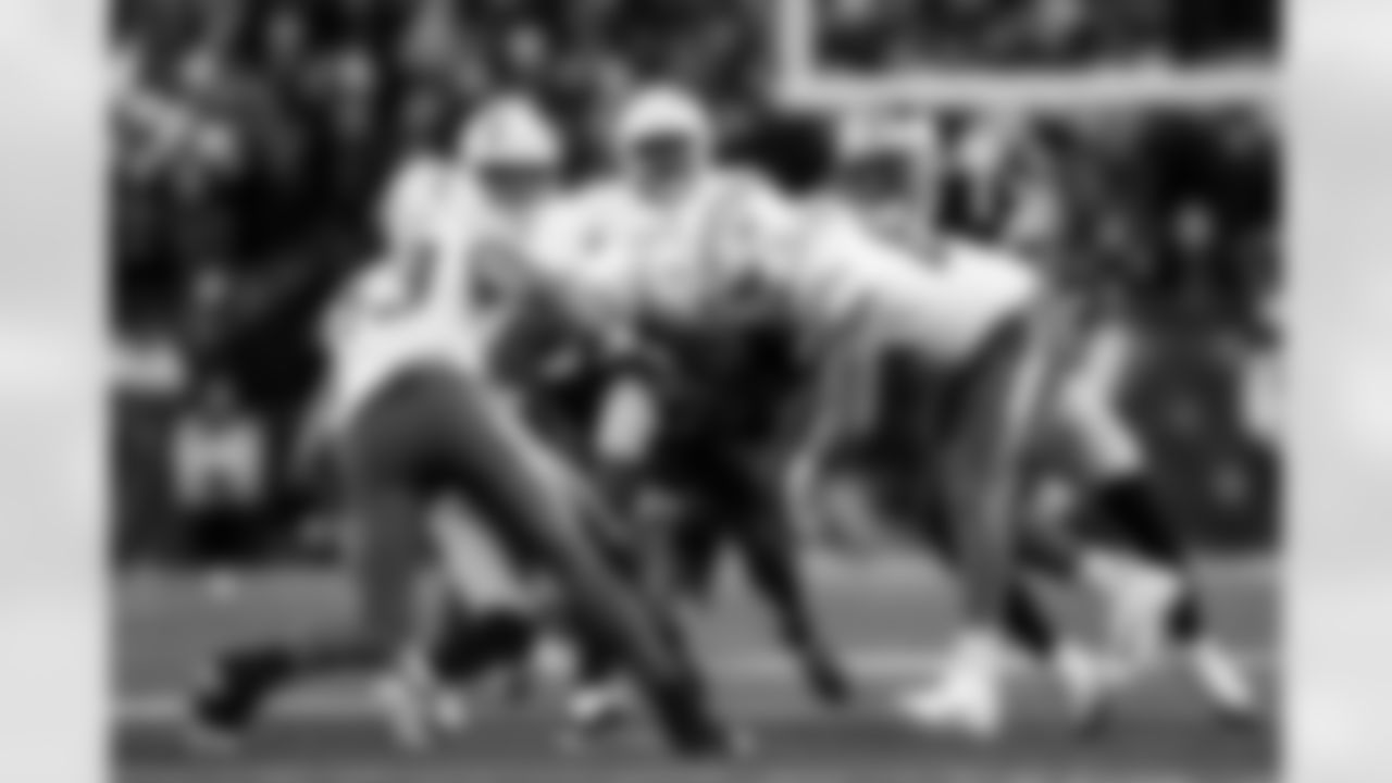 WR Tre Harris (9), TE Will Dissly (89) and LB Troy Dye (43)