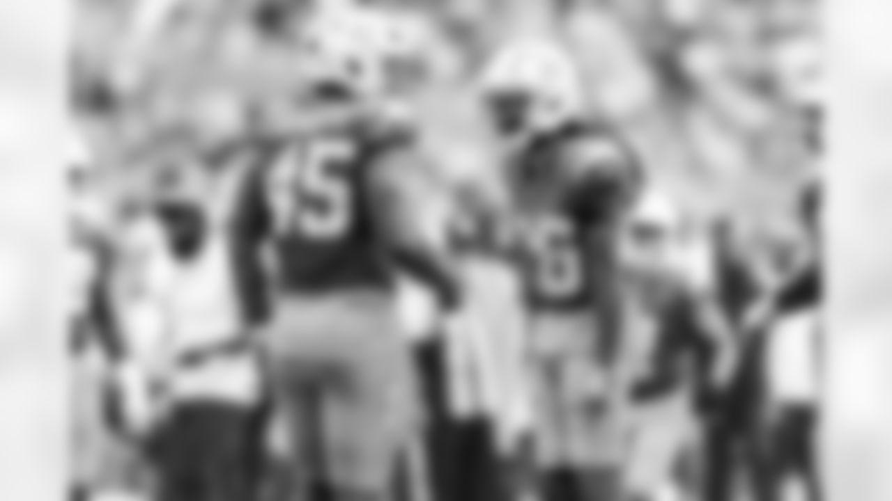 OLB Tuli Tuipulotu (45) and CB Donte Jackson (26)