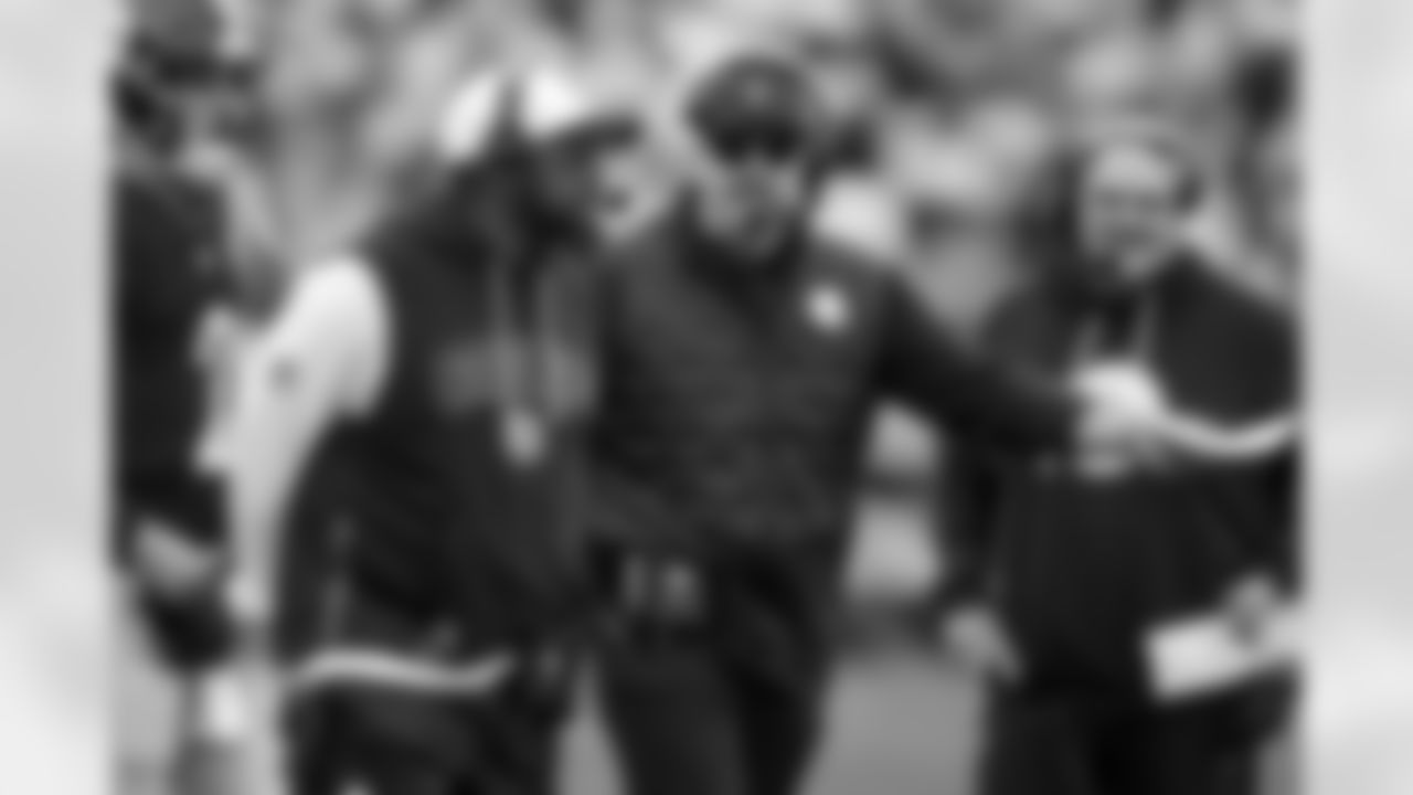 Pittsburgh Steelers head coach Mike Tomlin, second from left, and offensive coordinator Arthur Smith, center right, take a timeout during the second half of an NFL football game against the Indianapolis Colts Sunday, Nov. 2, 2025. (AP Photo/Gene J. Puskar)