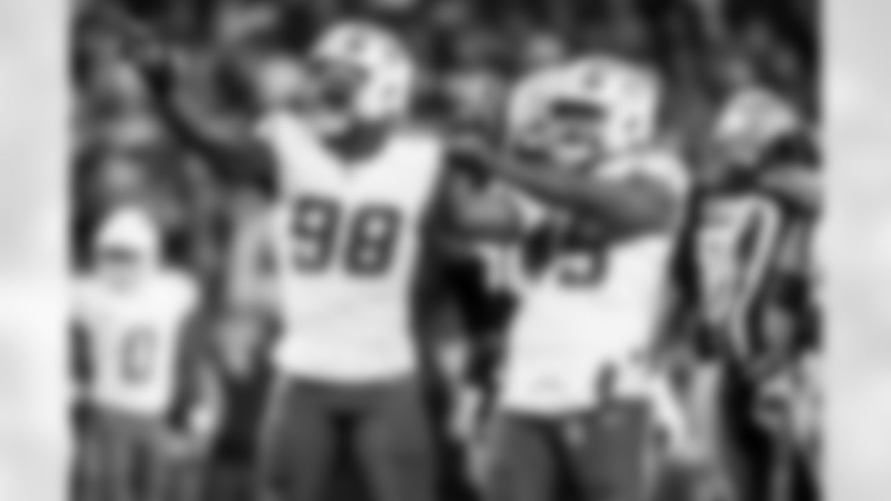 OLB Odafe Oweh (98) and OLB Tuli Tuipulotu (45)