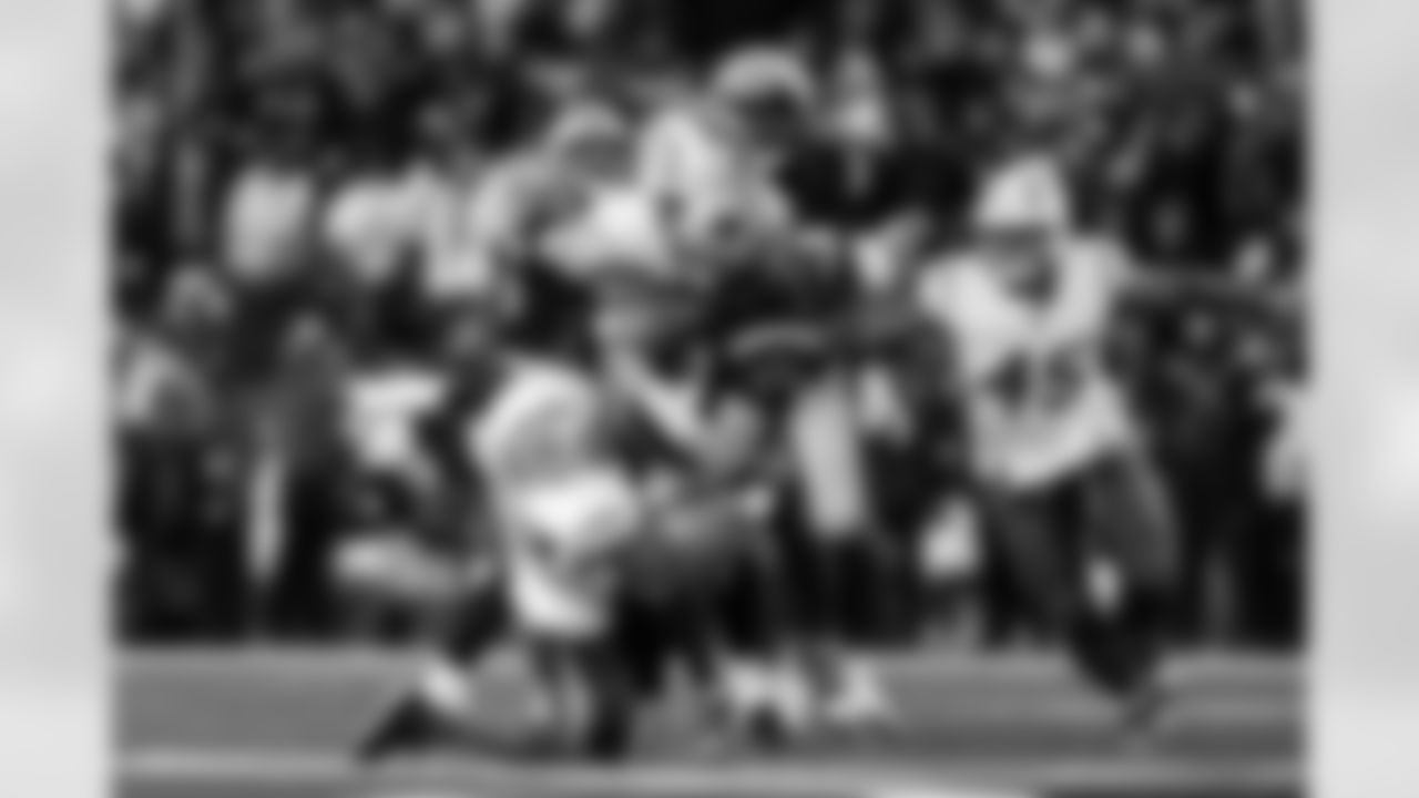 OLB Khalil Mack (52) and OLB Odafe Oweh (98)