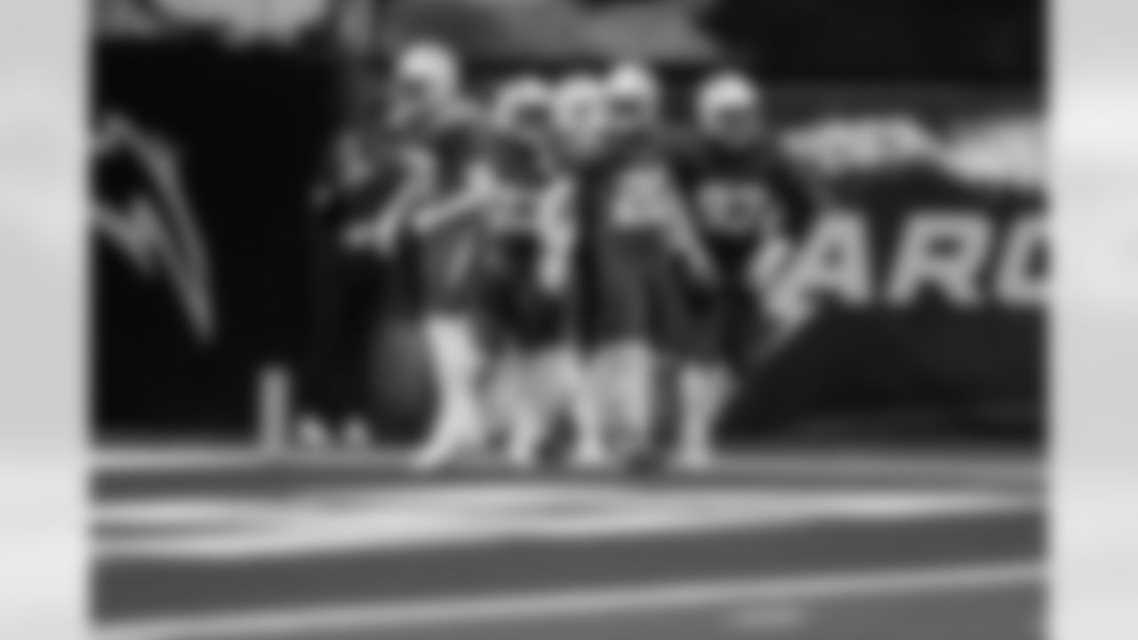 S RJ Mickens (27), CB Cam Hart (20) and DL Otito Ogbonnia (93)