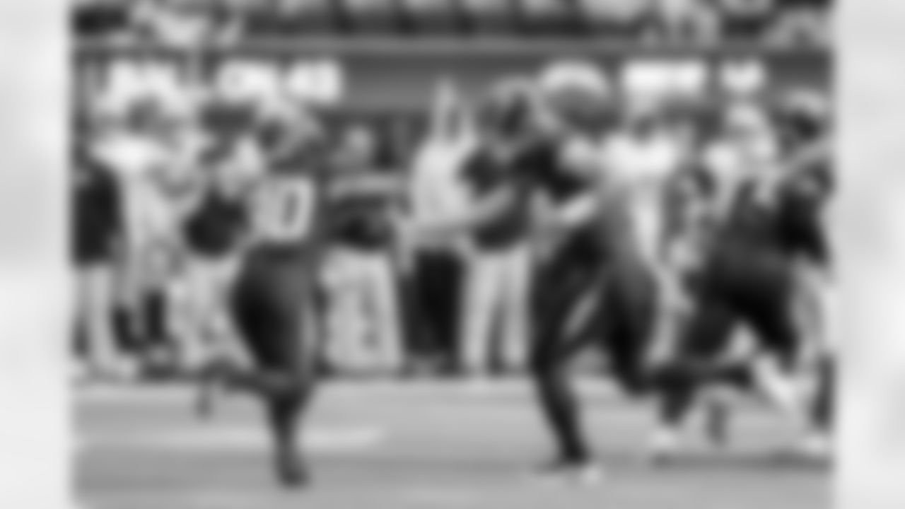 RB Kimani Vidal (30) and QB Justin Herbert (10)