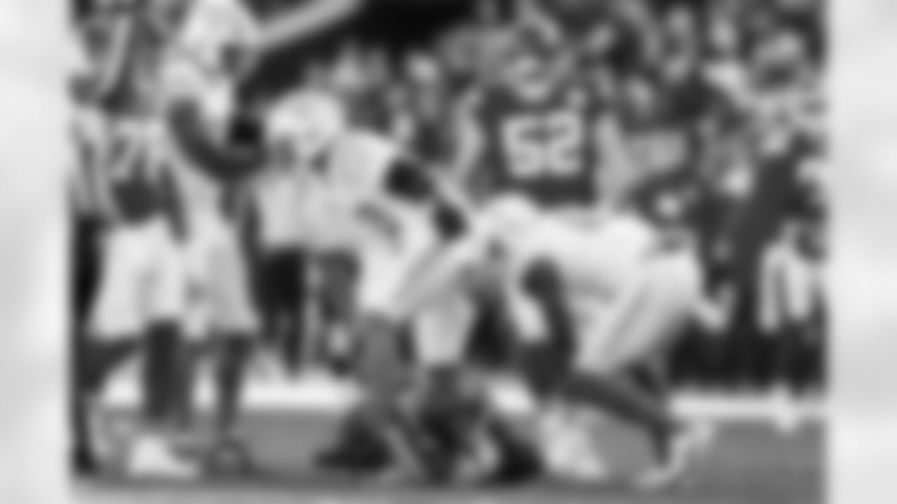 OLB Khalil Mack (52) and LB Daiyan Henley (0)