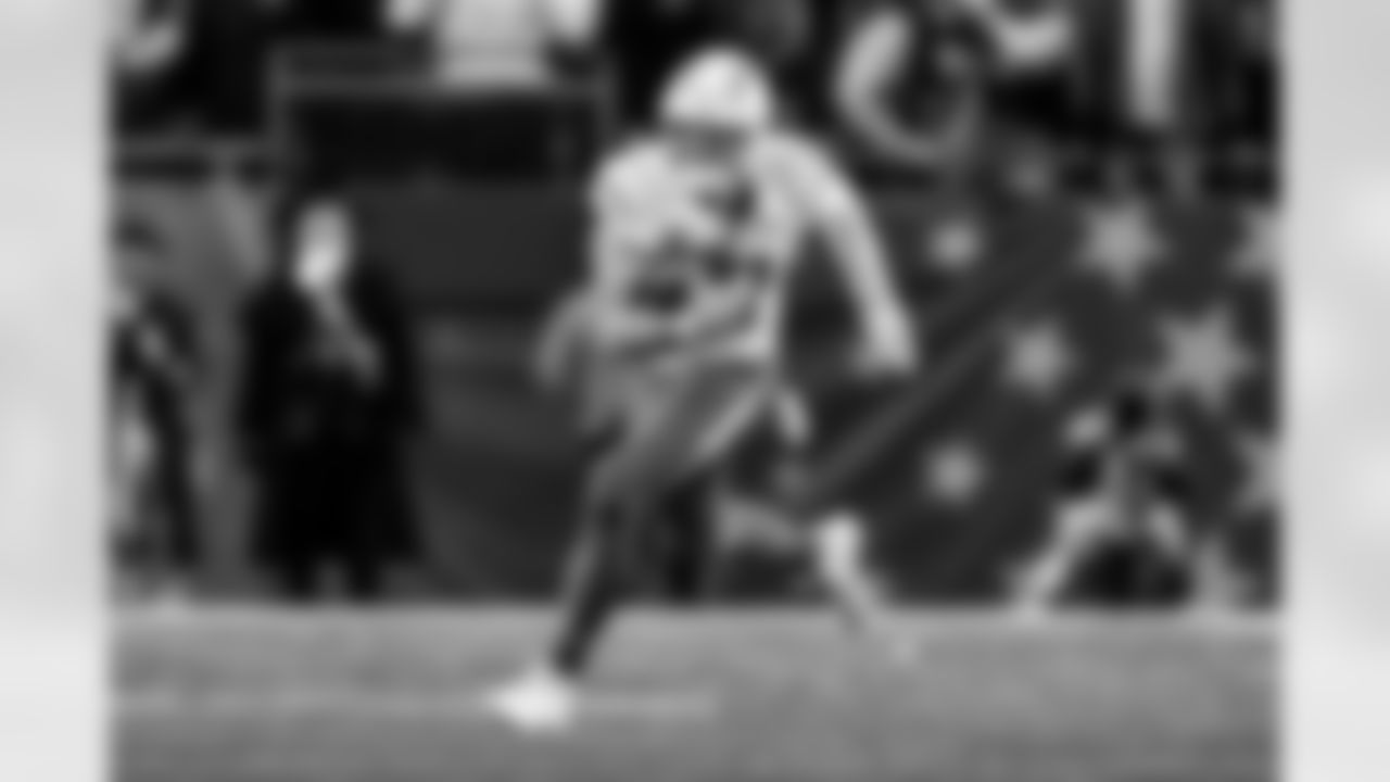 Check out the best shots from the Chargers Wild Card matchup against the Patriots!