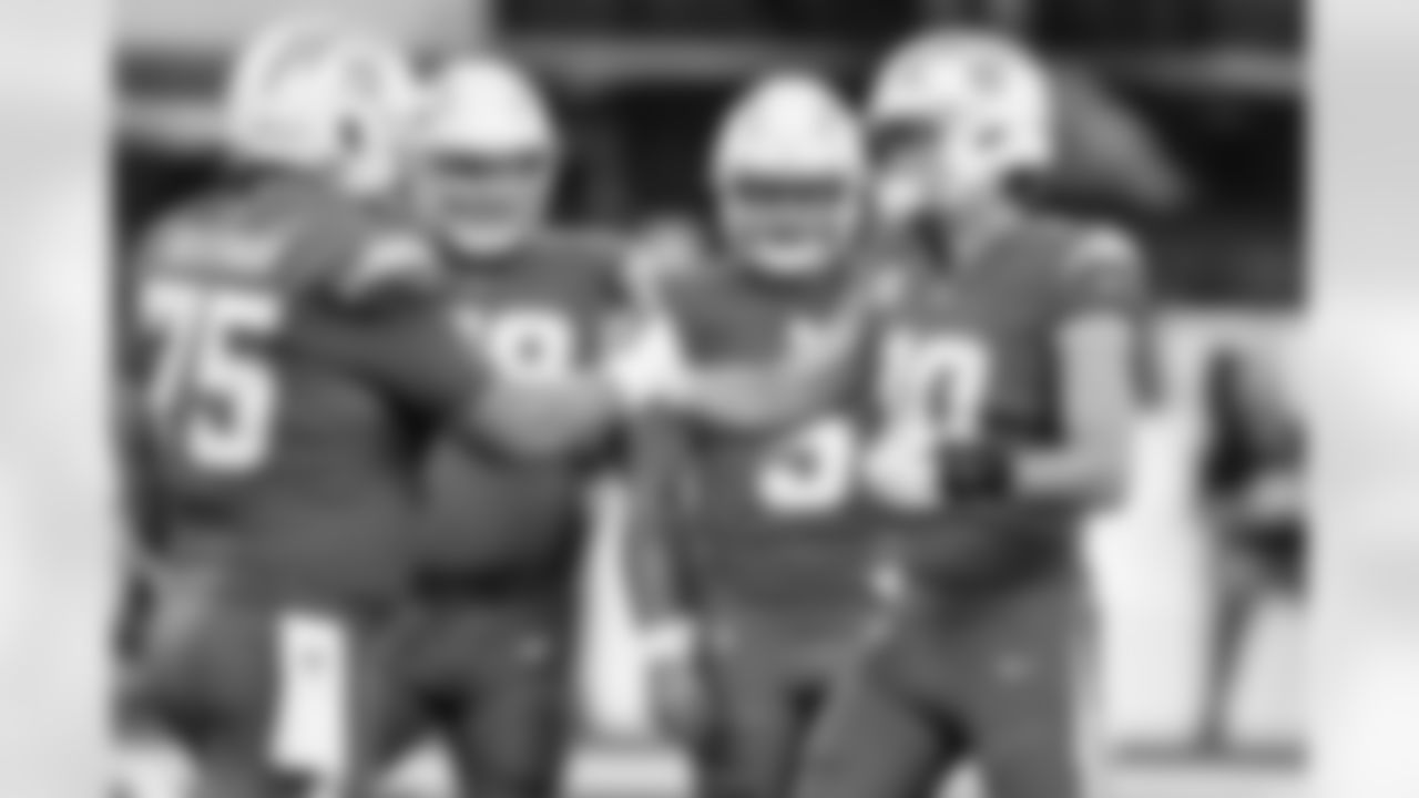 C Bradley Bozeman (75) and QB Justin Herbert (10)